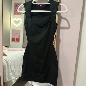 Edited black mini dress with back cut out size XS